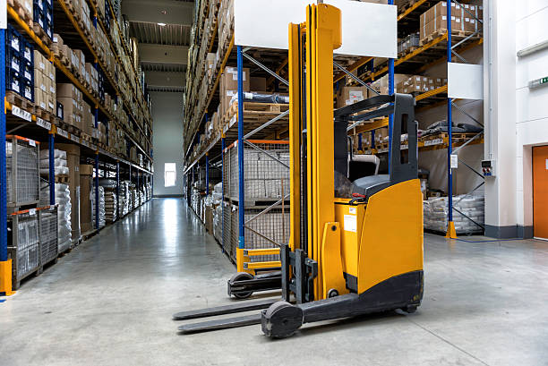 Yellow forklift placed inside of new distribution warehouse.